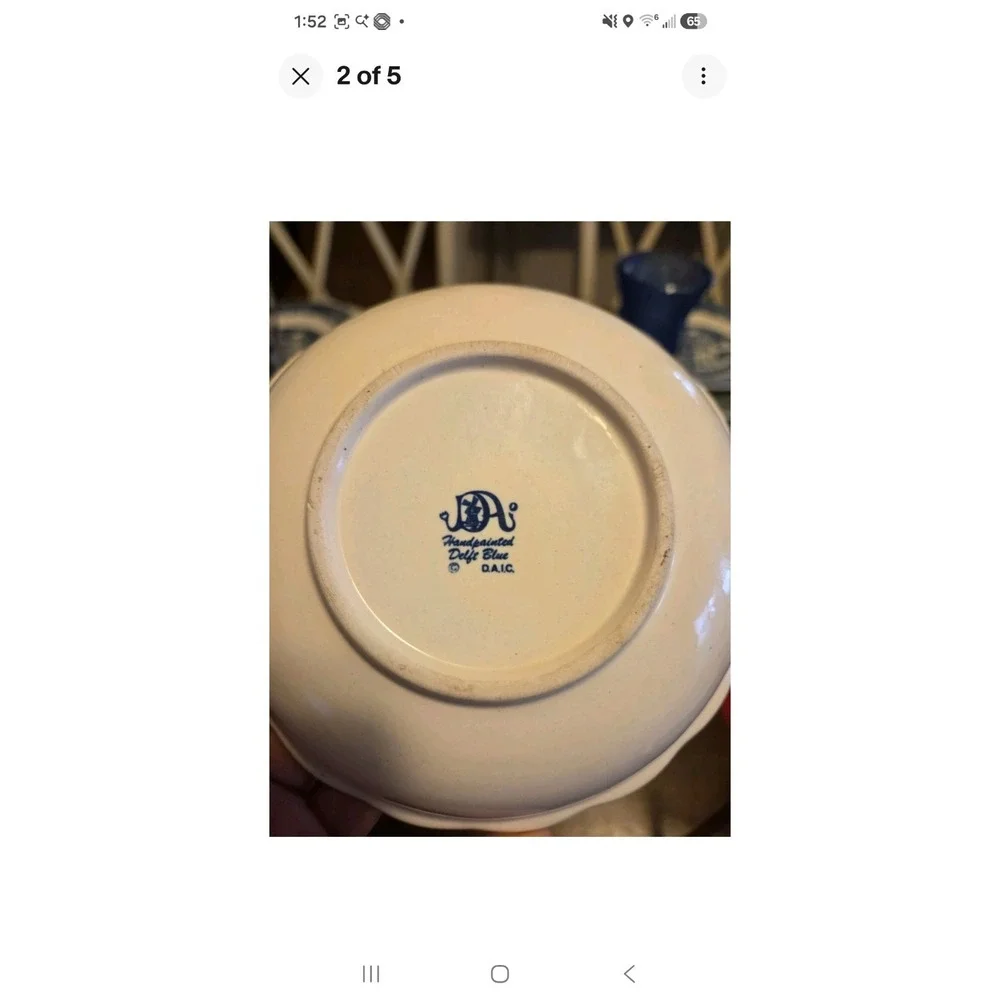 This is a vintage Delft Blue hand-painted ceramic creamer pitcher And Bowl/plate